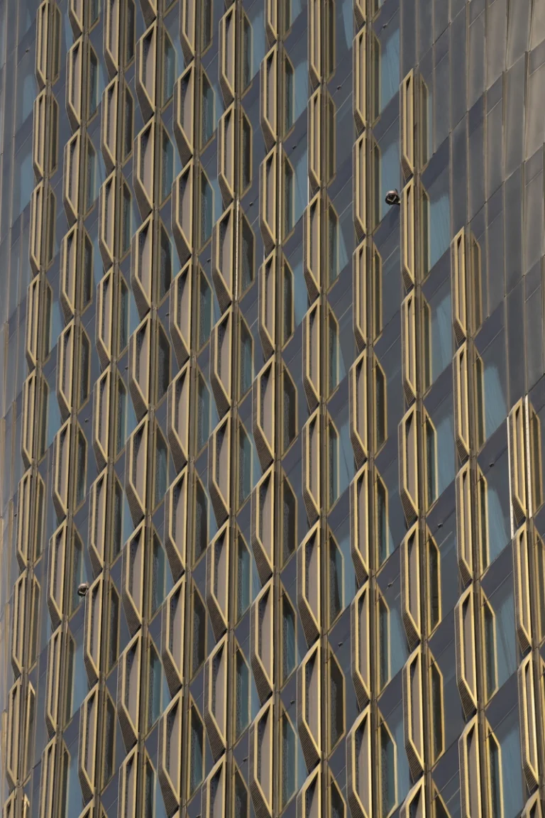 Architectural photograph by Deed Studio of the award-winning Wasl Tower in Dubai, designed by UNStudio, highlighting its iconic ceramic façade and presence within the GCC urban skyline.