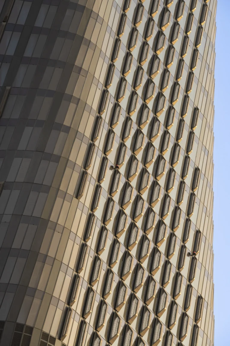 Architectural photograph by Deed Studio of the award-winning Wasl Tower in Dubai, designed by UNStudio, highlighting its iconic ceramic façade and presence within the GCC urban skyline.