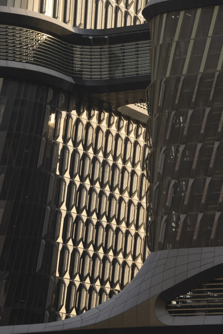 Architectural photograph by Deed Studio of the award-winning Wasl Tower in Dubai, designed by UNStudio, highlighting its iconic ceramic façade and presence within the GCC urban skyline.