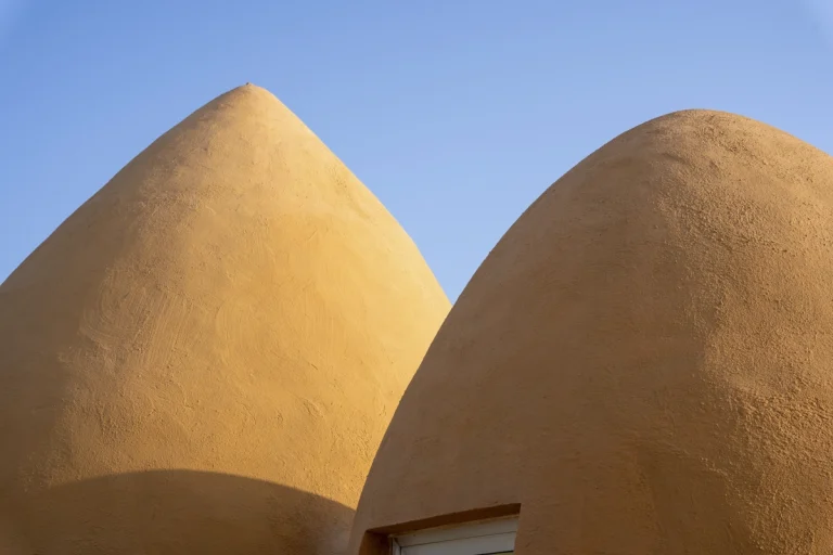 Architectural photograph of the Majara Complex and Community Redevelopment, an Aga Khan Award–winning project, captured by a worldwide architectural photography studio, highlighting the project’s vibrant forms and community-driven design