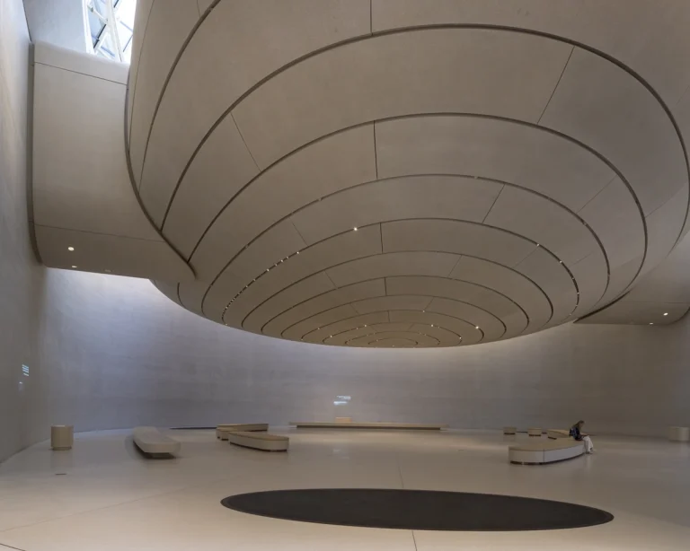 the Zayed National Museum in Abu Dhabi, designed by Foster + Partners, showcasing the five soaring falcon-wing-inspired steel structures and its contextual location in the Saadiyat Cultural District 11