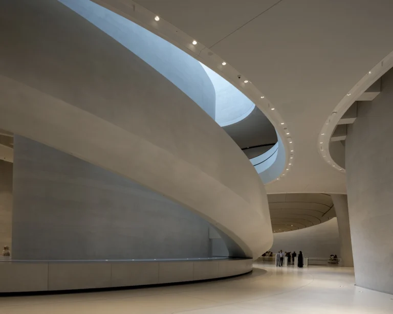 the Zayed National Museum in Abu Dhabi, designed by Foster + Partners, showcasing the five soaring falcon-wing-inspired steel structures and its contextual location in the Saadiyat Cultural District 11