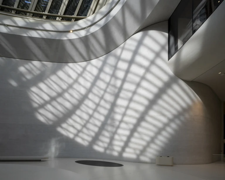 the Zayed National Museum in Abu Dhabi, designed by Foster + Partners, showcasing the five soaring falcon-wing-inspired steel structures and its contextual location in the Saadiyat Cultural District 11