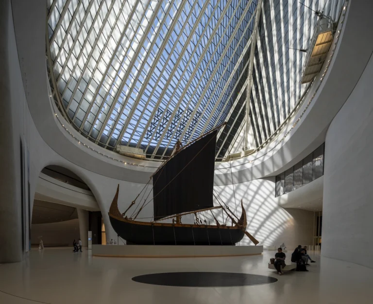 the Zayed National Museum in Abu Dhabi, designed by Foster + Partners, showcasing the five soaring falcon-wing-inspired steel structures and its contextual location in the Saadiyat Cultural District 11