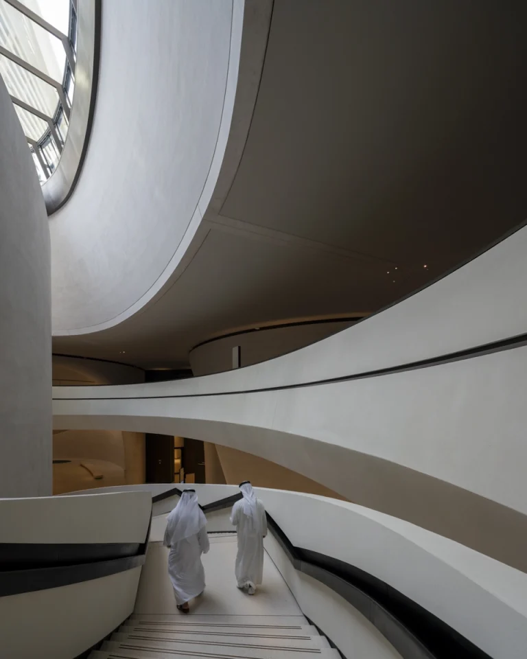 the Zayed National Museum in Abu Dhabi, designed by Foster + Partners, showcasing the five soaring falcon-wing-inspired steel structures and its contextual location in the Saadiyat Cultural District 11