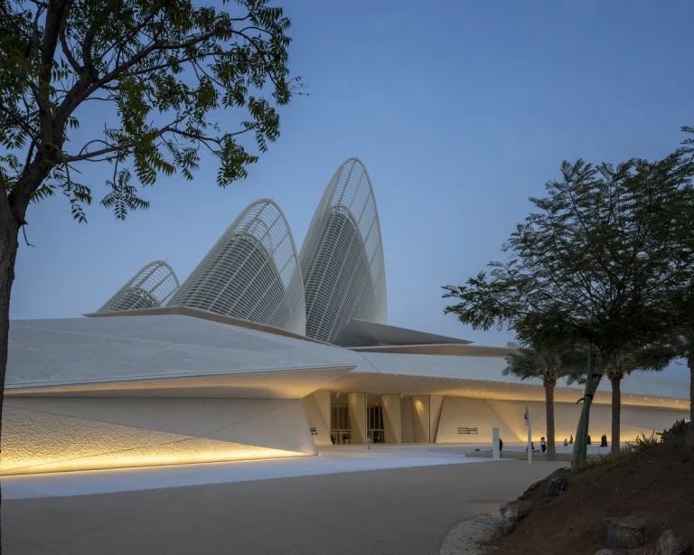 the Zayed National Museum in Abu Dhabi, designed by Foster + Partners, showcasing the five soaring falcon-wing-inspired steel structures and its contextual location in the Saadiyat Cultural District 11