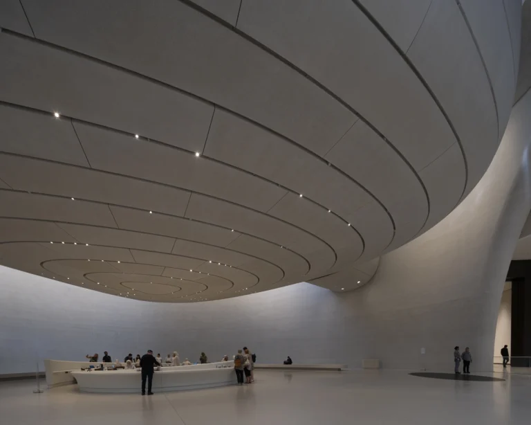 the Zayed National Museum in Abu Dhabi, designed by Foster + Partners, showcasing the five soaring falcon-wing-inspired steel structures and its contextual location in the Saadiyat Cultural District 11