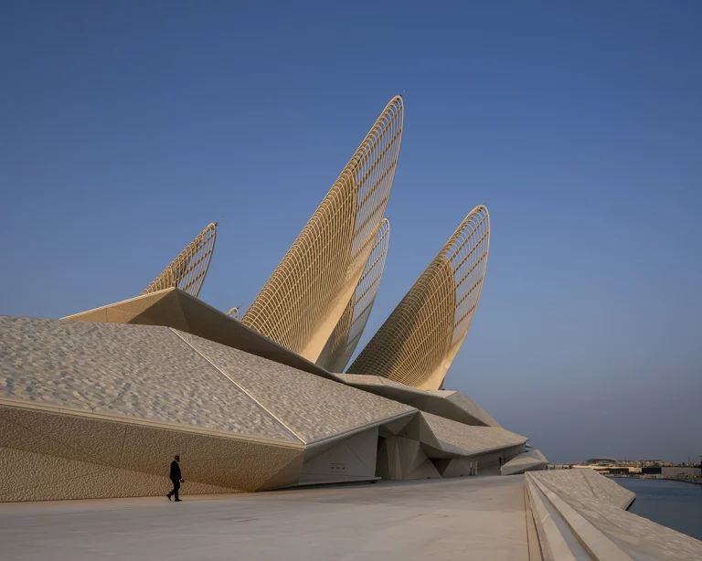 the Zayed National Museum in Abu Dhabi, designed by Foster + Partners, showcasing the five soaring falcon-wing-inspired steel structures and its contextual location in the Saadiyat Cultural District 11