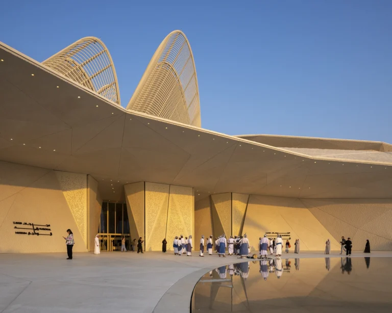 the Zayed National Museum in Abu Dhabi, designed by Foster + Partners, showcasing the five soaring falcon-wing-inspired steel structures and its contextual location in the Saadiyat Cultural District 11