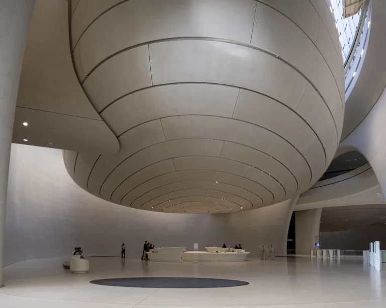 the Zayed National Museum in Abu Dhabi, designed by Foster + Partners, showcasing the five soaring falcon-wing-inspired steel structures and its contextual location in the Saadiyat Cultural District 11
