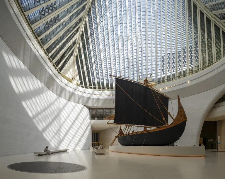 the Zayed National Museum in Abu Dhabi, designed by Foster + Partners, showcasing the five soaring falcon-wing-inspired steel structures and its contextual location in the Saadiyat Cultural District 11