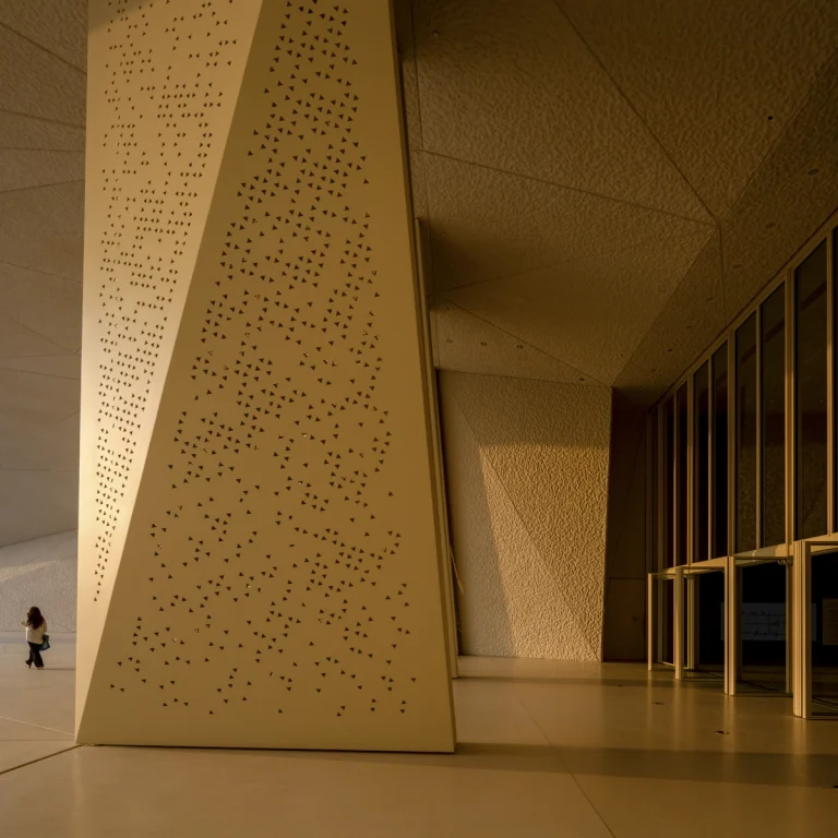 the Zayed National Museum in Abu Dhabi, designed by Foster + Partners, showcasing the five soaring falcon-wing-inspired steel structures and its contextual location in the Saadiyat Cultural District 11