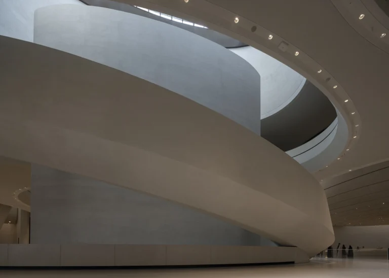 the Zayed National Museum in Abu Dhabi, designed by Foster + Partners, showcasing the five soaring falcon-wing-inspired steel structures and its contextual location in the Saadiyat Cultural District 11