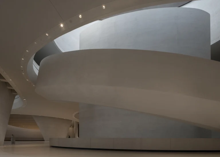 the Zayed National Museum in Abu Dhabi, designed by Foster + Partners, showcasing the five soaring falcon-wing-inspired steel structures and its contextual location in the Saadiyat Cultural District 11