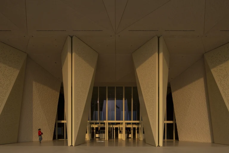 the Zayed National Museum in Abu Dhabi, designed by Foster + Partners, showcasing the five soaring falcon-wing-inspired steel structures and its contextual location in the Saadiyat Cultural District 11