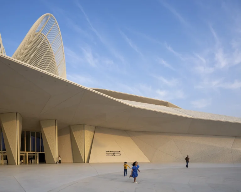 the Zayed National Museum in Abu Dhabi, designed by Foster + Partners, showcasing the five soaring falcon-wing-inspired steel structures and its contextual location in the Saadiyat Cultural District 11