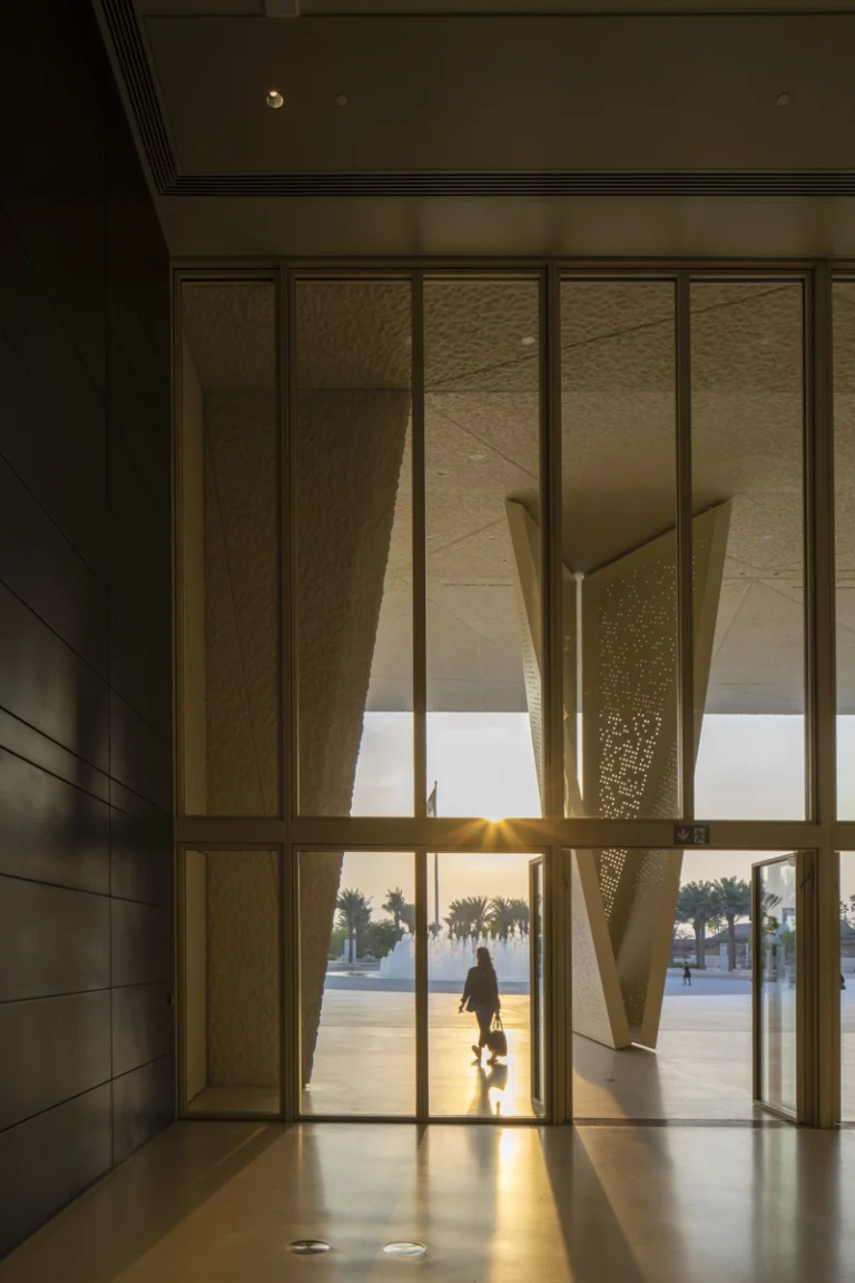 the Zayed National Museum in Abu Dhabi, designed by Foster + Partners, showcasing the five soaring falcon-wing-inspired steel structures and its contextual location in the Saadiyat Cultural District 11