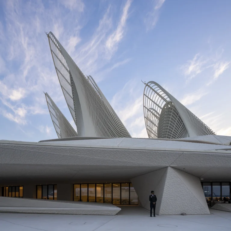 the Zayed National Museum in Abu Dhabi, designed by Foster + Partners, showcasing the five soaring falcon-wing-inspired steel structures and its contextual location in the Saadiyat Cultural District 11