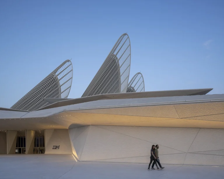 the Zayed National Museum in Abu Dhabi, designed by Foster + Partners, showcasing the five soaring falcon-wing-inspired steel structures and its contextual location in the Saadiyat Cultural District 11