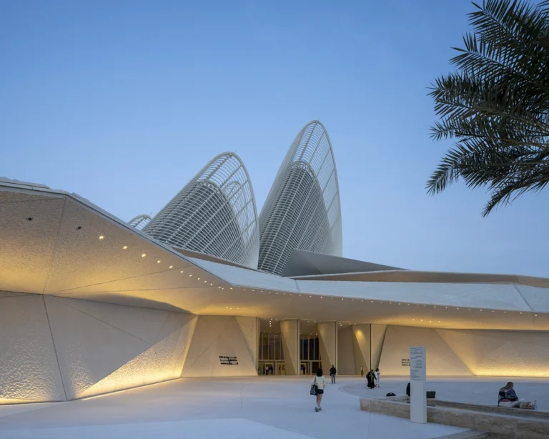 the Zayed National Museum in Abu Dhabi, designed by Foster + Partners, showcasing the five soaring falcon-wing-inspired steel structures and its contextual location in the Saadiyat Cultural District 11