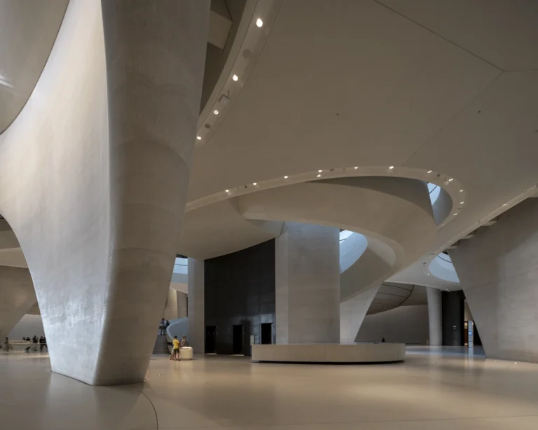 the Zayed National Museum in Abu Dhabi, designed by Foster + Partners, showcasing the five soaring falcon-wing-inspired steel structures and its contextual location in the Saadiyat Cultural District 11