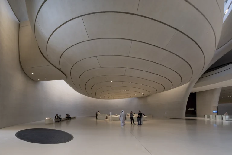 the Zayed National Museum in Abu Dhabi, designed by Foster + Partners, showcasing the five soaring falcon-wing-inspired steel structures and its contextual location in the Saadiyat Cultural District 11