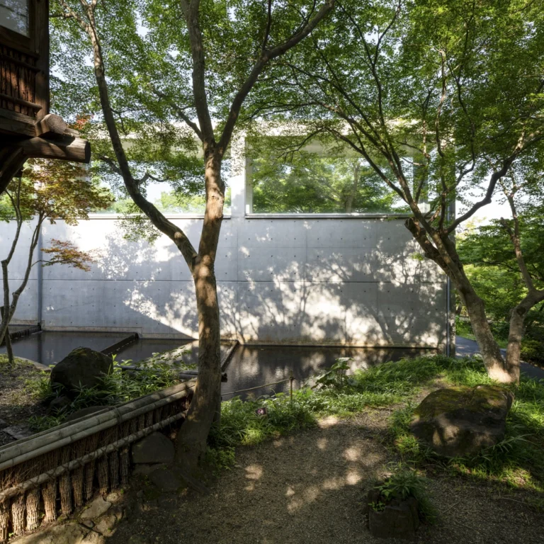 Architectural view of Asahi Beer Oyamazaki Villa Museum of Art in Osaka by Tadao Ando, photographed by award-winning Deed Studio, emphasizing the interplay of natural light, exposed concrete, and minimal form