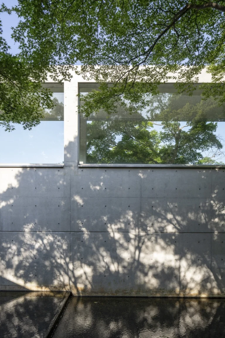 Architectural view of Asahi Beer Oyamazaki Villa Museum of Art in Osaka by Tadao Ando, photographed by award-winning Deed Studio, emphasizing the interplay of natural light, exposed concrete, and minimal form