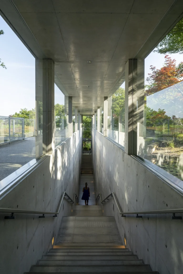 Architectural view of Asahi Beer Oyamazaki Villa Museum of Art in Osaka by Tadao Ando, photographed by award-winning Deed Studio, emphasizing the interplay of natural light, exposed concrete, and minimal form