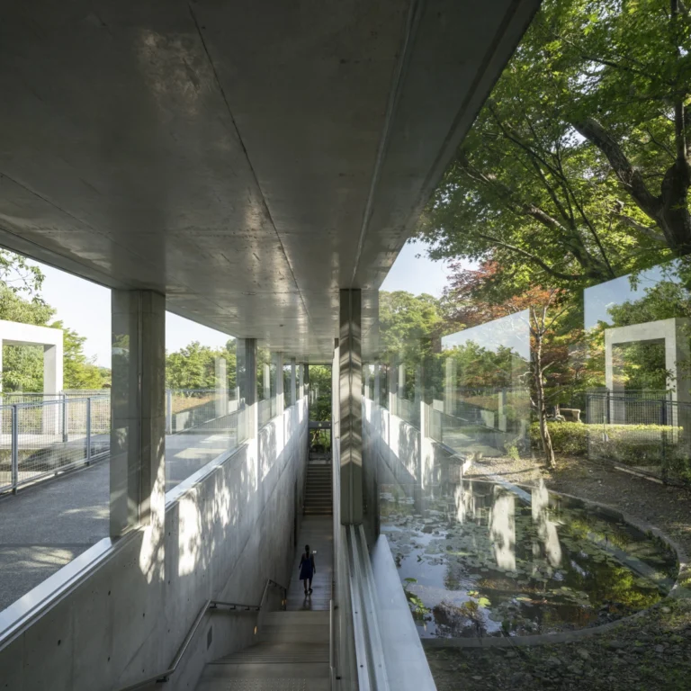 Architectural view of Asahi Beer Oyamazaki Villa Museum of Art in Osaka by Tadao Ando, photographed by award-winning Deed Studio, emphasizing the interplay of natural light, exposed concrete, and minimal form