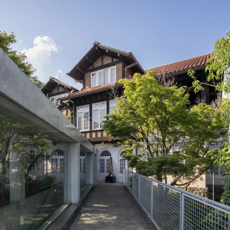 Architectural view of Asahi Beer Oyamazaki Villa Museum of Art in Osaka by Tadao Ando, photographed by award-winning Deed Studio, emphasizing the interplay of natural light, exposed concrete, and minimal form