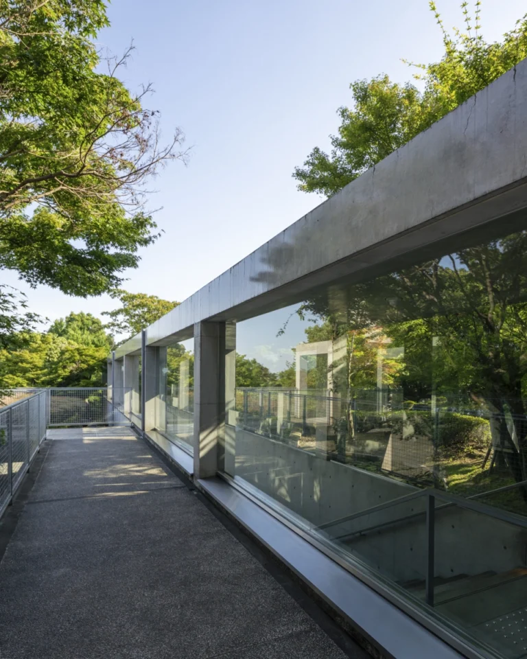 Architectural view of Asahi Beer Oyamazaki Villa Museum of Art in Osaka by Tadao Ando, photographed by award-winning Deed Studio, emphasizing the interplay of natural light, exposed concrete, and minimal form