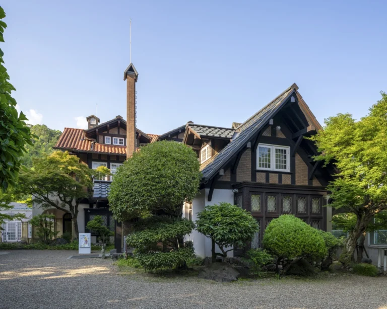 Architectural view of Asahi Beer Oyamazaki Villa Museum of Art in Osaka by Tadao Ando, photographed by award-winning Deed Studio, emphasizing the interplay of natural light, exposed concrete, and minimal form