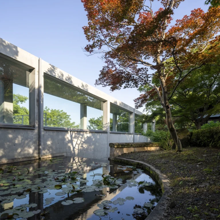 Architectural view of Asahi Beer Oyamazaki Villa Museum of Art in Osaka by Tadao Ando, photographed by award-winning Deed Studio, emphasizing the interplay of natural light, exposed concrete, and minimal form