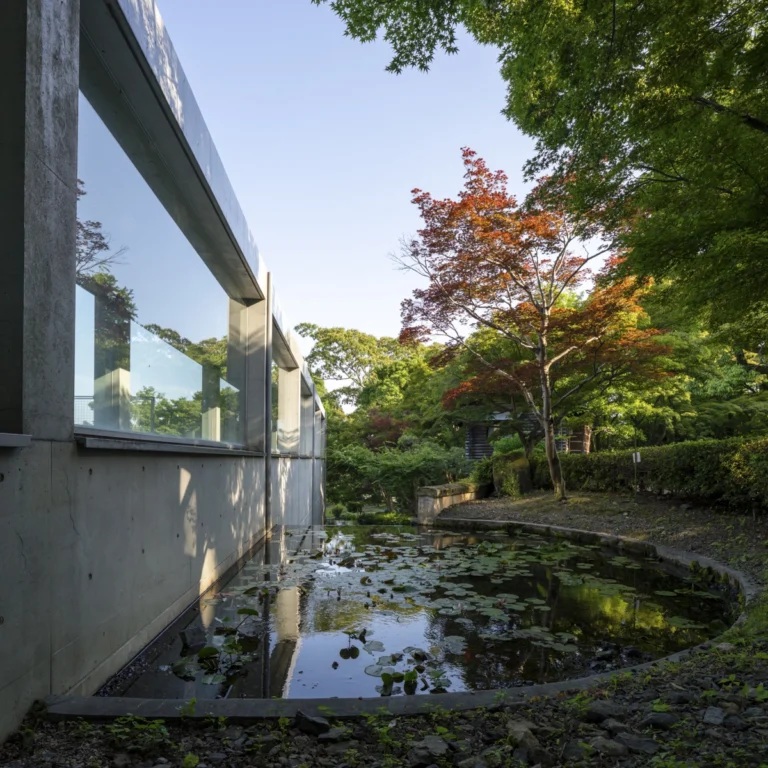Architectural view of Asahi Beer Oyamazaki Villa Museum of Art in Osaka by Tadao Ando, photographed by award-winning Deed Studio, emphasizing the interplay of natural light, exposed concrete, and minimal form