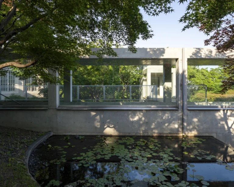Architectural view of Asahi Beer Oyamazaki Villa Museum of Art in Osaka by Tadao Ando, photographed by award-winning Deed Studio, emphasizing the interplay of natural light, exposed concrete, and minimal form