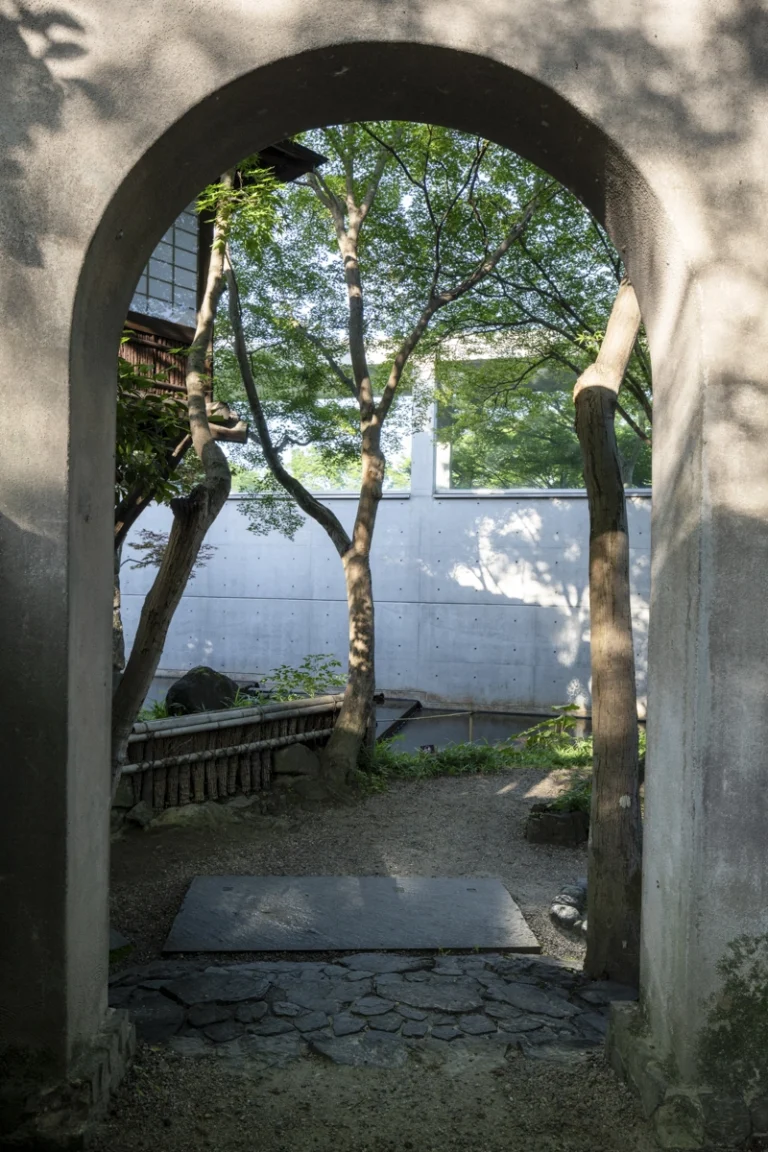 Architectural view of Asahi Beer Oyamazaki Villa Museum of Art in Osaka by Tadao Ando, photographed by award-winning Deed Studio, emphasizing the interplay of natural light, exposed concrete, and minimal form