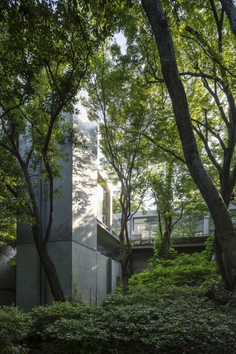 Architectural view of Asahi Beer Oyamazaki Villa Museum of Art in Osaka by Tadao Ando, photographed by award-winning Deed Studio, emphasizing the interplay of natural light, exposed concrete, and minimal form
