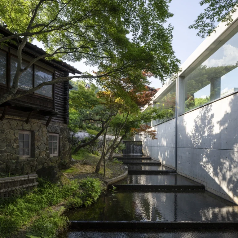 Architectural view of Asahi Beer Oyamazaki Villa Museum of Art in Osaka by Tadao Ando, photographed by award-winning Deed Studio, emphasizing the interplay of natural light, exposed concrete, and minimal form