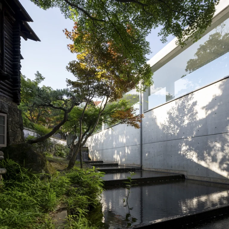 Architectural view of Asahi Beer Oyamazaki Villa Museum of Art in Osaka by Tadao Ando, photographed by award-winning Deed Studio, emphasizing the interplay of natural light, exposed concrete, and minimal form