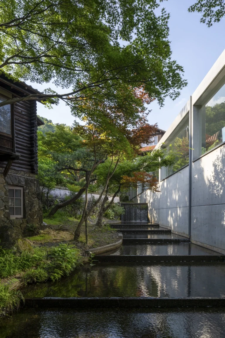 Architectural view of Asahi Beer Oyamazaki Villa Museum of Art in Osaka by Tadao Ando, photographed by award-winning Deed Studio, emphasizing the interplay of natural light, exposed concrete, and minimal form
