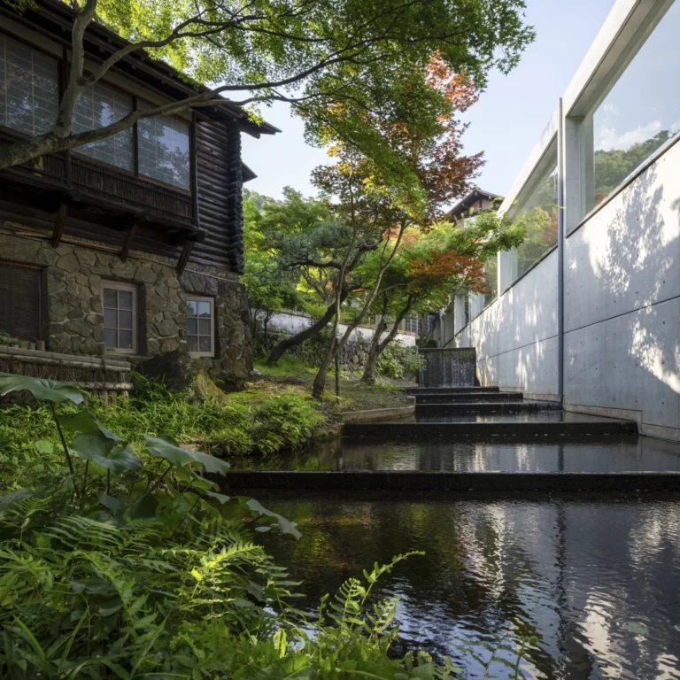 Architectural view of Asahi Beer Oyamazaki Villa Museum of Art in Osaka by Tadao Ando, photographed by award-winning Deed Studio, emphasizing the interplay of natural light, exposed concrete, and minimal form