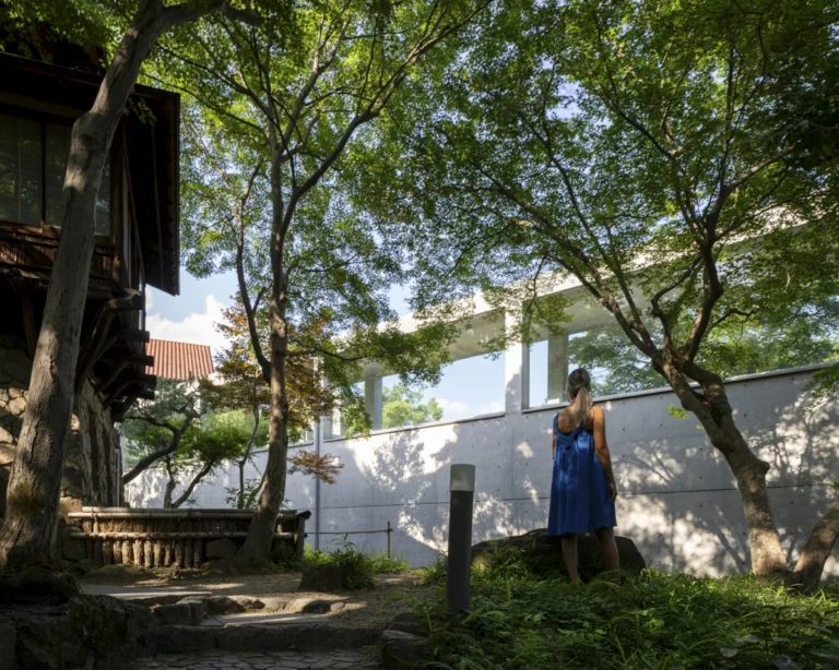 Architectural view of Asahi Beer Oyamazaki Villa Museum of Art in Osaka by Tadao Ando, photographed by award-winning Deed Studio, emphasizing the interplay of natural light, exposed concrete, and minimal form