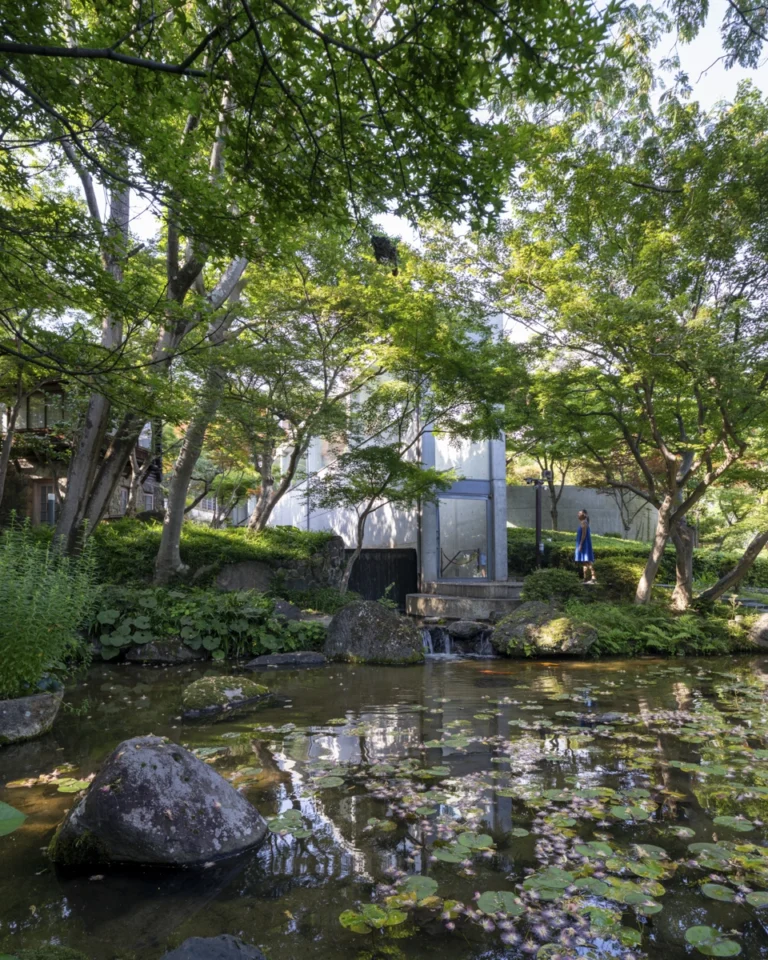 Architectural view of Asahi Beer Oyamazaki Villa Museum of Art in Osaka by Tadao Ando, photographed by award-winning Deed Studio, emphasizing the interplay of natural light, exposed concrete, and minimal form