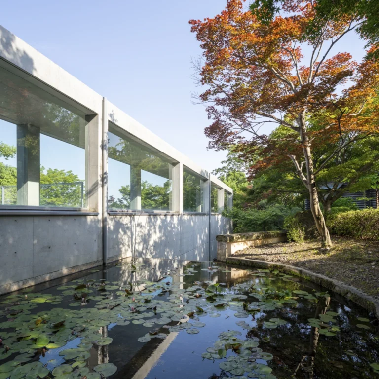 Architectural view of Asahi Beer Oyamazaki Villa Museum of Art in Osaka by Tadao Ando, photographed by award-winning Deed Studio, emphasizing the interplay of natural light, exposed concrete, and minimal form