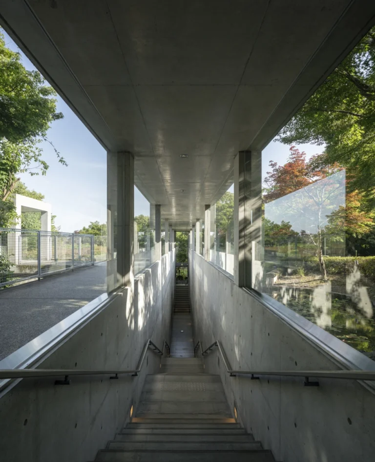 Architectural view of Asahi Beer Oyamazaki Villa Museum of Art in Osaka by Tadao Ando, photographed by award-winning Deed Studio, emphasizing the interplay of natural light, exposed concrete, and minimal form