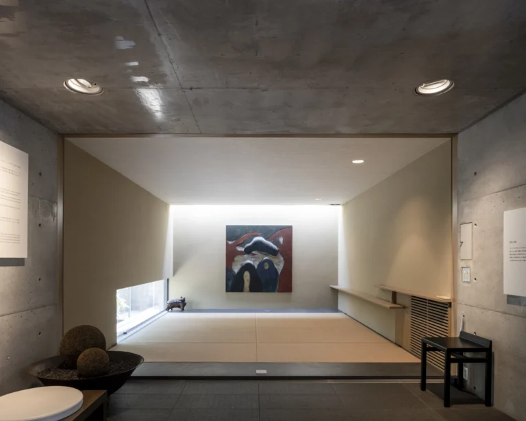 Deed Studio, an award-winning architecture photography studio based in Dubai and the GCC, captures the Koshino House by Tadao Ando—a minimalist concrete home set into a wooded hillside, defined by curved and rectilinear forms and soft natural light filtering through narrow skylights