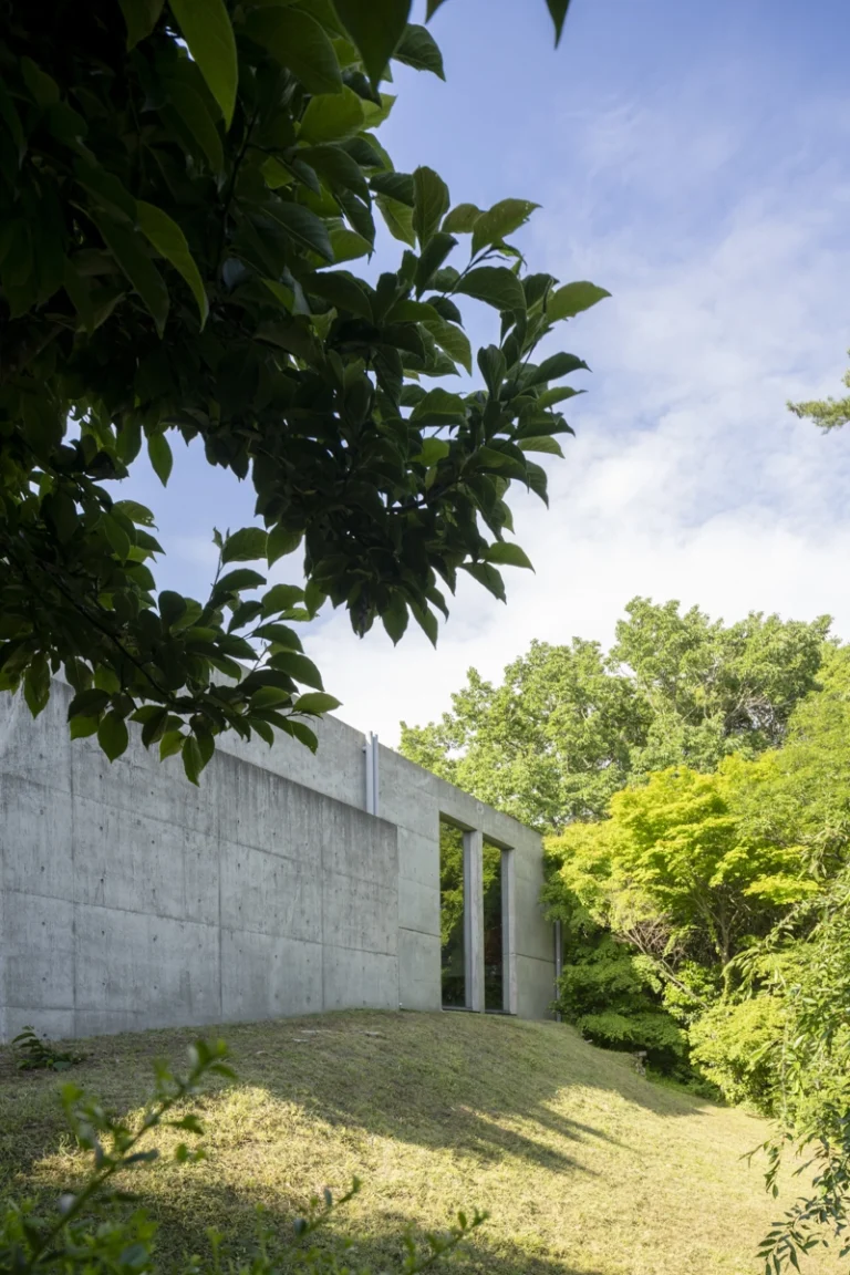 Deed Studio, an award-winning architecture photography studio based in Dubai and the GCC, captures the Koshino House by Tadao Ando—a minimalist concrete home set into a wooded hillside, defined by curved and rectilinear forms and soft natural light filtering through narrow skylights