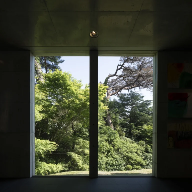 Deed Studio, an award-winning architecture photography studio based in Dubai and the GCC, captures the Koshino House by Tadao Ando—a minimalist concrete home set into a wooded hillside, defined by curved and rectilinear forms and soft natural light filtering through narrow skylights