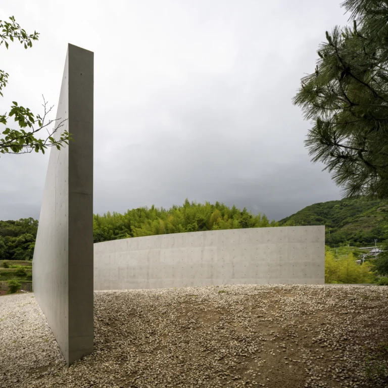 Water Temple in Awaji, Japan designed by Tadao Ando, with a circular lotus pond concealing an underground sanctuary, emphasizing minimalism and spatial sequence.